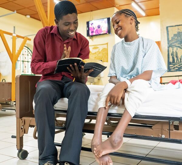 reading the bible to a cure patient