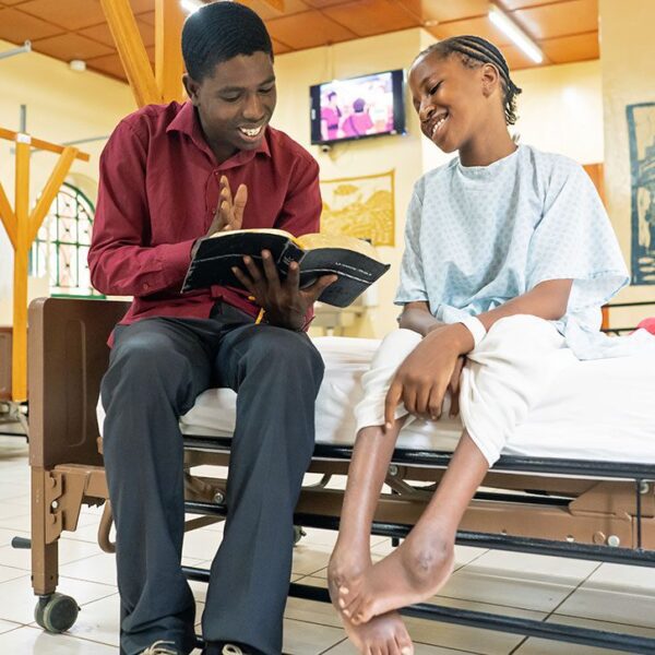 reading the bible to a cure patient