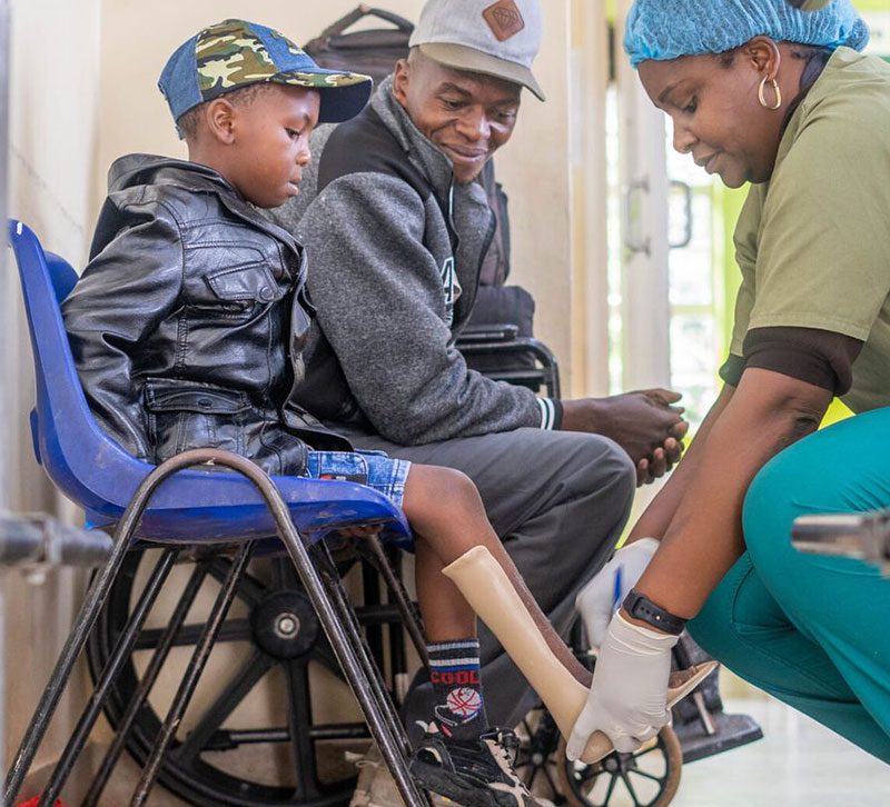 cure patient being fitted for a brace