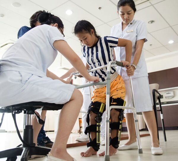 patient in leg braces