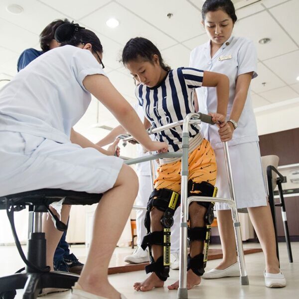 patient in leg braces