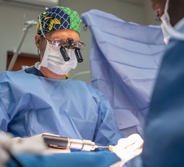 Surgeon holding a surgical drill