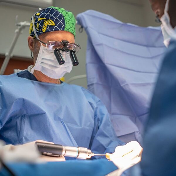 Surgeon holding a surgical drill